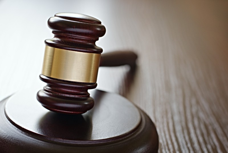 Gavel Close Up on Wooden Desk