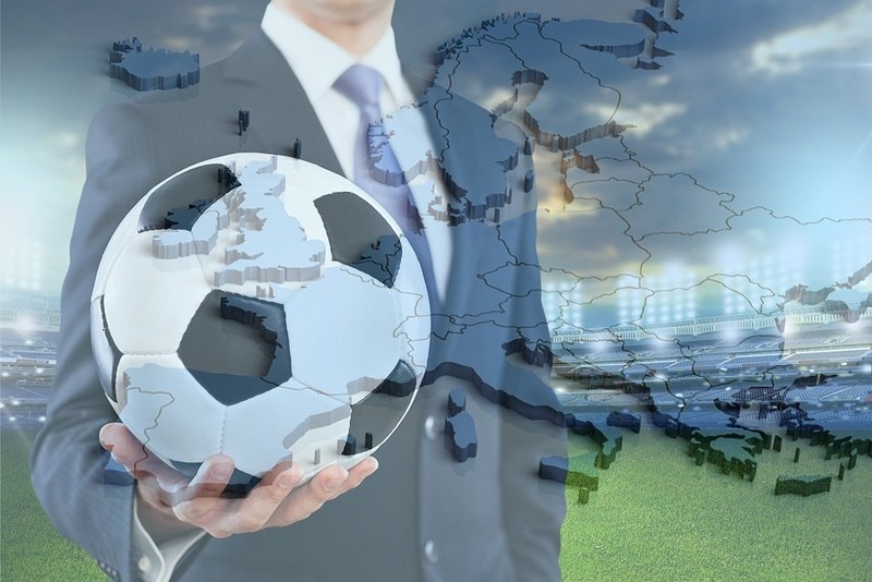 Map of Europe Against Man in Blue Suit with Football