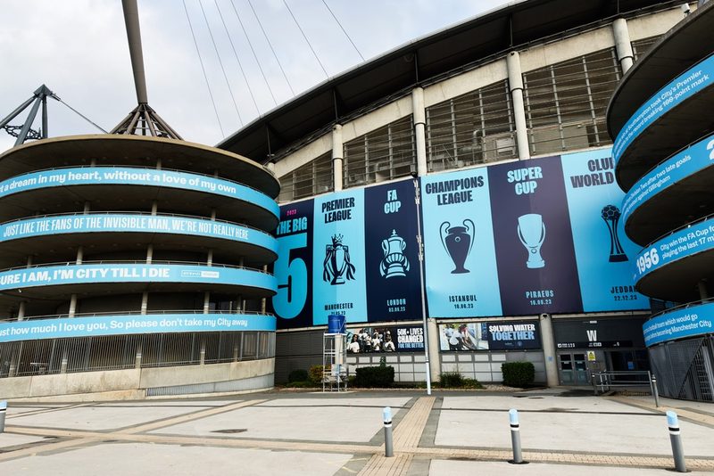 Manchester City Etihad Stadium with Trophies Banner
